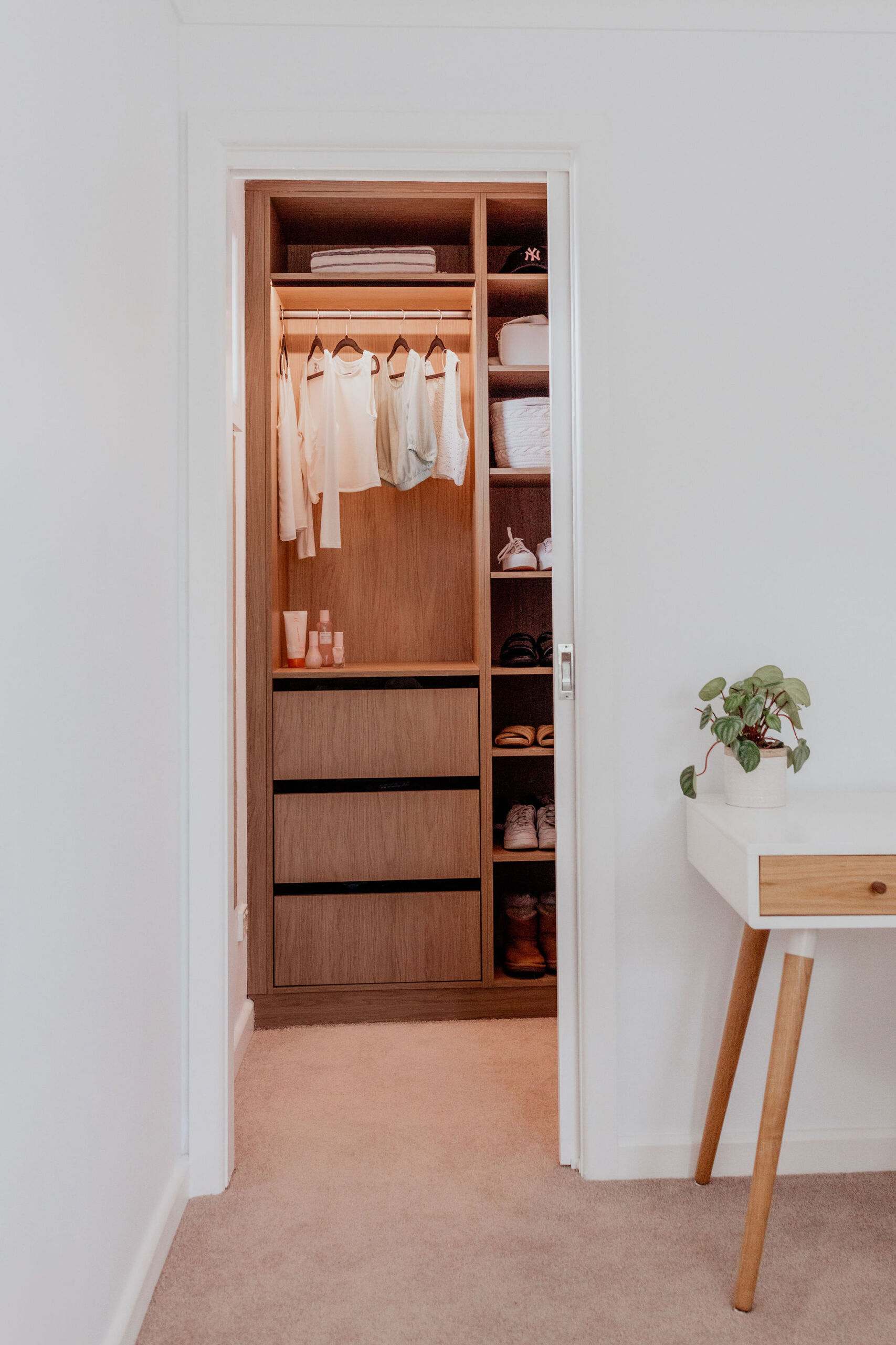 097A1737 Walk in wardrobe with hanging space, soft close drawers and open shelves.