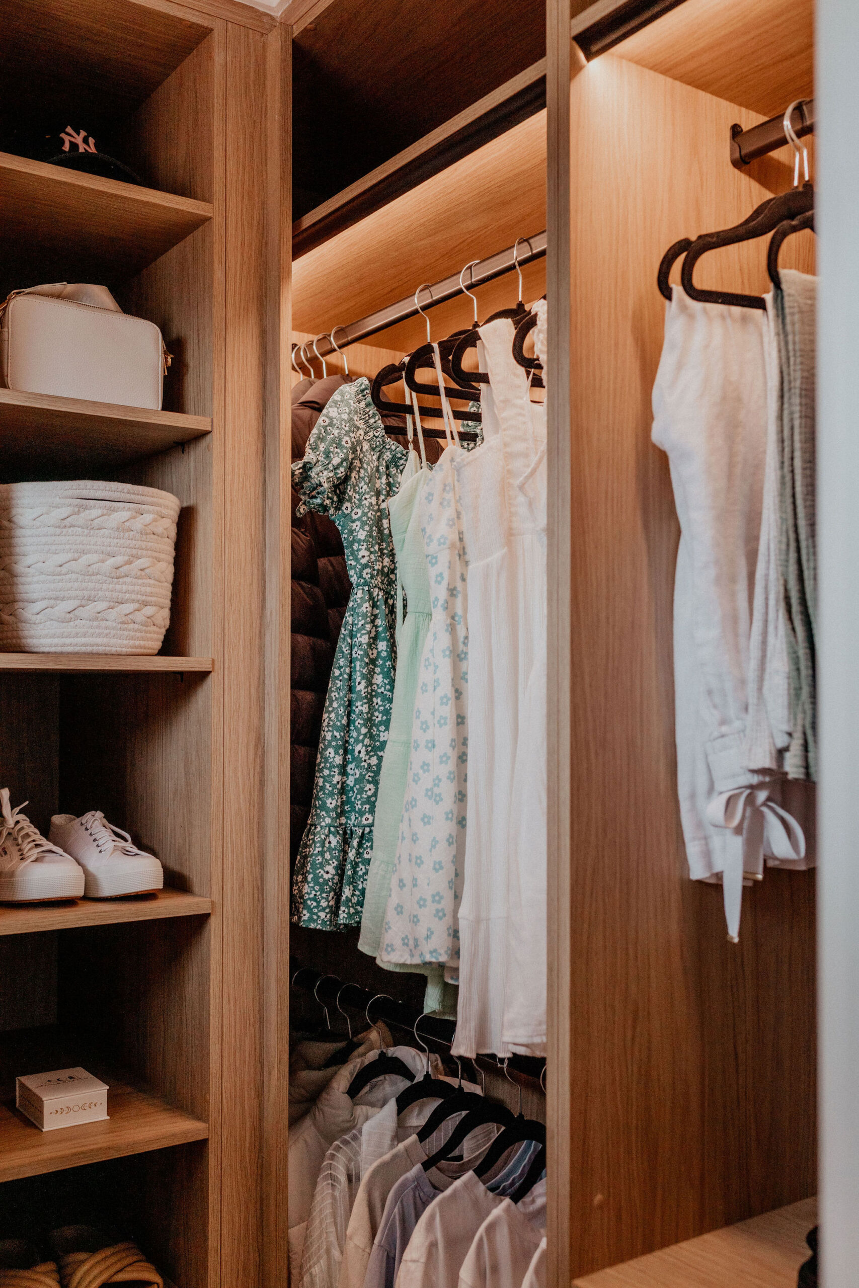 097A1777 Close up photo of walk in wardrobe with hanging and shelving.