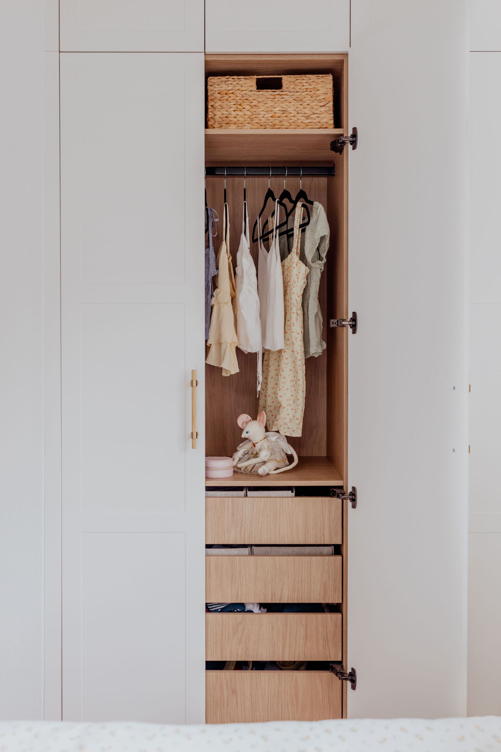 097A2433 White wardrobe with timber oak look interior finish with hanging and soft close drawers.